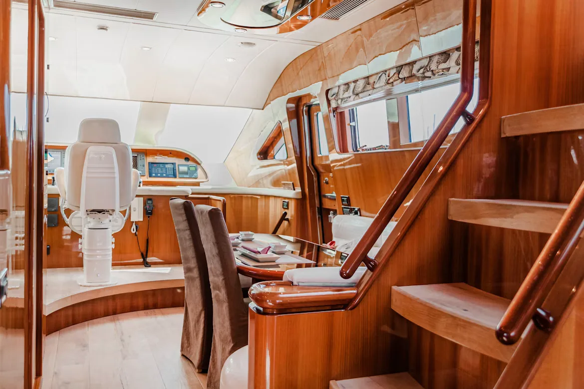 Polished wood interior and helm station of a luxury yacht