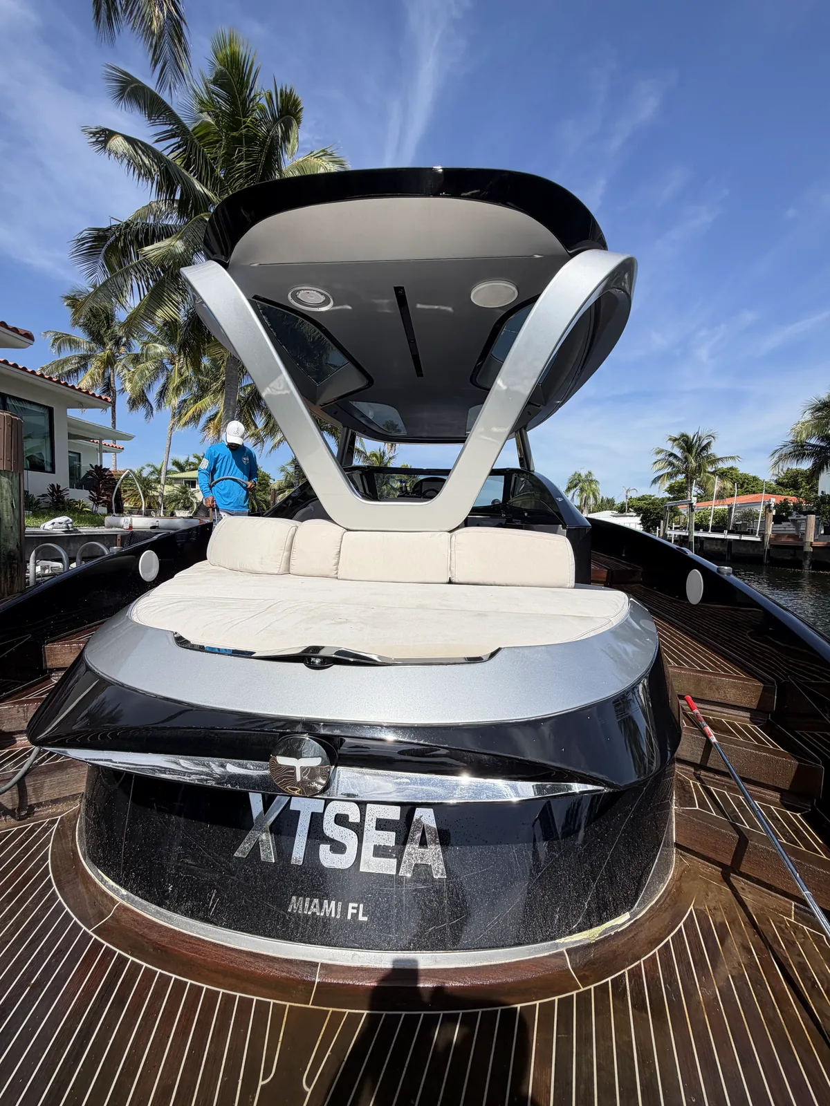 Detailed XTSEA boat stern and sun pad on a teak dock in Miami